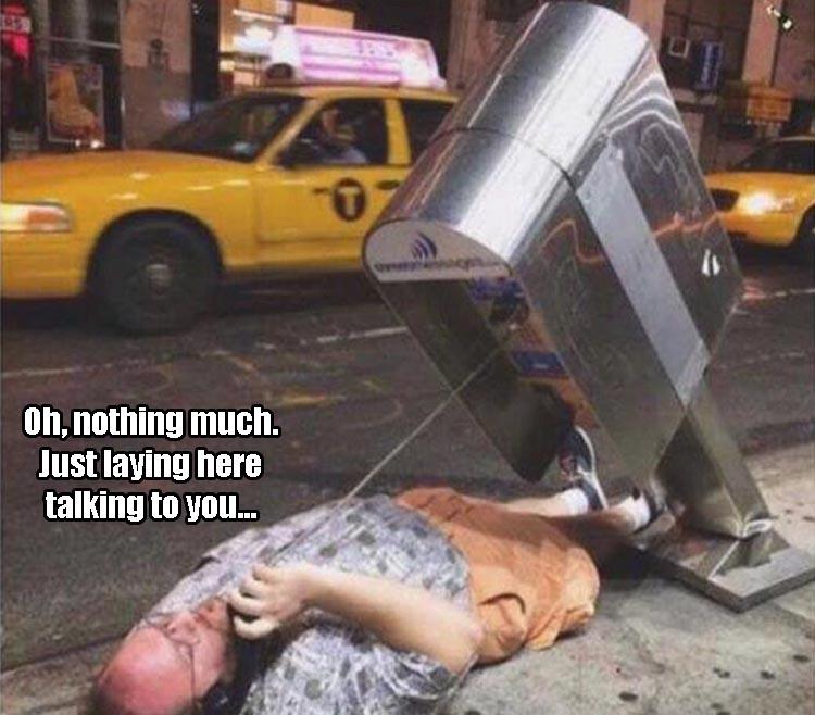Funniest meme of someone laying on the ground talking on a bent phone stand.