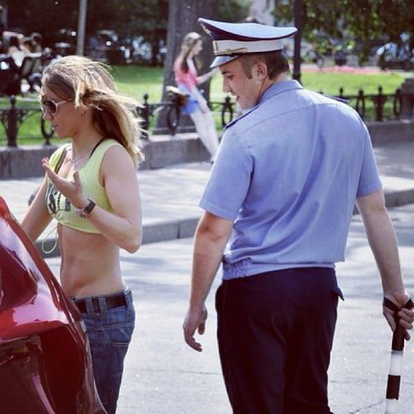 cop looking at a woman