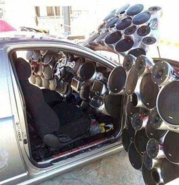 Funny picture of a car with way too many speaker, or maybe not enough.