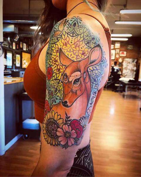 Hot girl with an awesome tattoo on her arm of a deer.