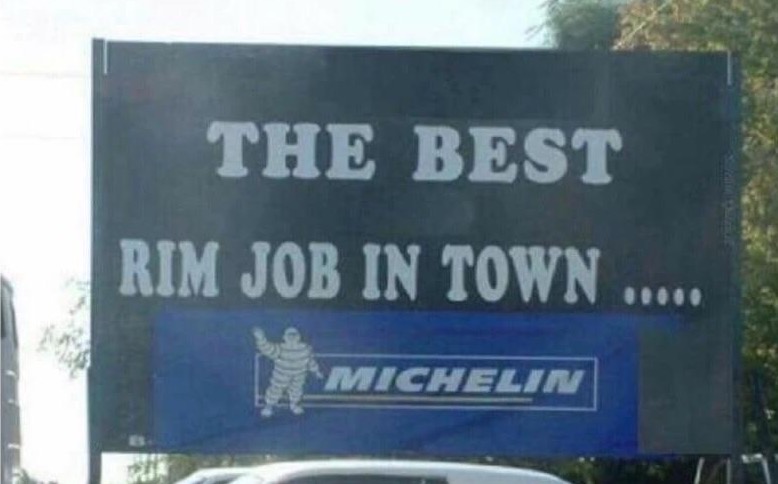 Pun sign for tire shop selling Michelin tires 'rim job'
