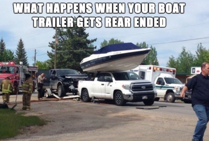 WTF meme of of boat atop a car in what appears to be a rear ended boat trailer.