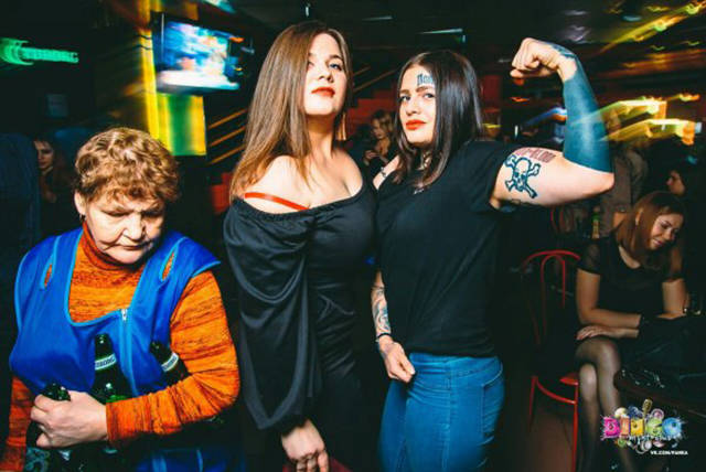 Cringeworthy Russian party pics of woman showing off her muscles and a cleaning woman tidying up the bottles