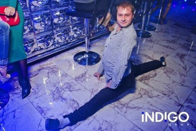 Cringeworthy Russian party pics of dude doing the splits right on the floor.