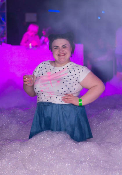 Cringeworthy Russian party pics of solid looking woman about waste deep in bubble foam