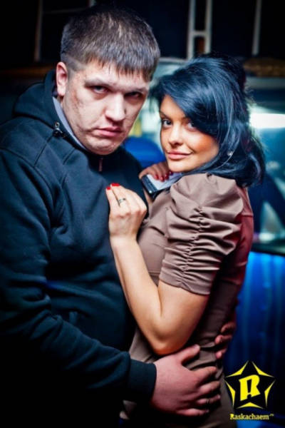 Cringeworthy Russian party pics of bad looking fat dude with his hands all some girl.
