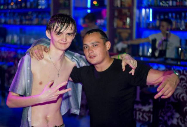 Cringeworthy Russian party pics of shirtless sweatiness at a bar scene