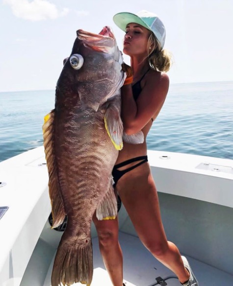 Woman that caught massive fish.