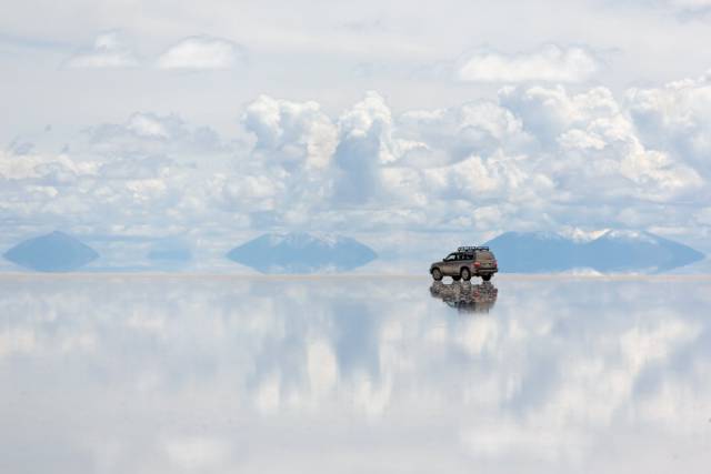 Salar de Uyuni, Bolivia

Salar de Uyuni is the world's largest salt flat, located in southwestern Bolivia. All it takes is a thin layer of water on the flat's surface to create a mirror-like appearance on the ground that extends into the horizon.