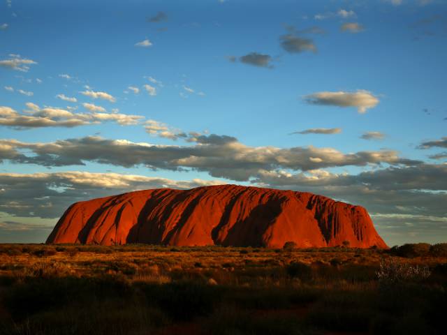 Uluru (Ayer's Rock), Australia

Uluru, also known as Ayer's Rock, is located in a remote area in Australia's Northern Territory, home to the Anangu Aboriginal people. The giant sandstone formation has a circumference of about 5.8 miles.