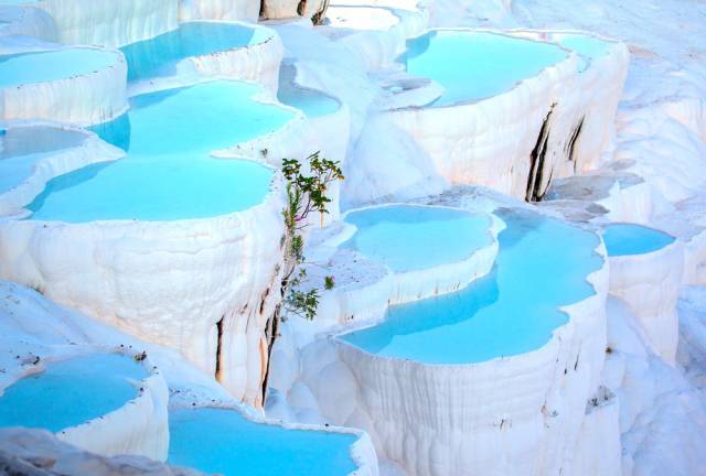 Pamukkale, Turkey

It's no mystery why these travertine stone steps and tiered pools are called Pamukkale, which translates to "cotton castle" in Turkish.