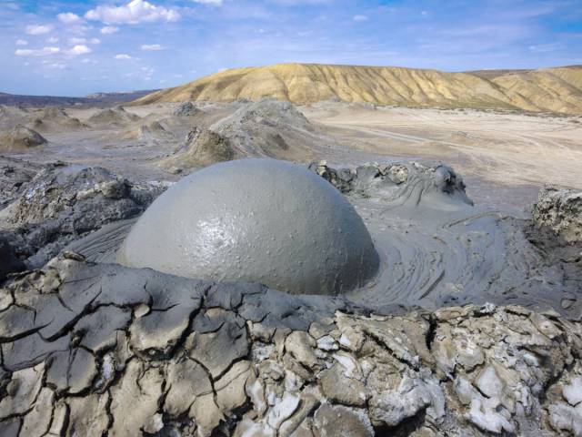 Mud volcanoes, Gobustan, Azerbaijan

Azerbaijan's sedimentary volcanoes, commonly known as mud volcanoes, are a mesmerizing geological phenomenon in which pockets of gas underground force their way to the Earth's surface and consequently bubble up.