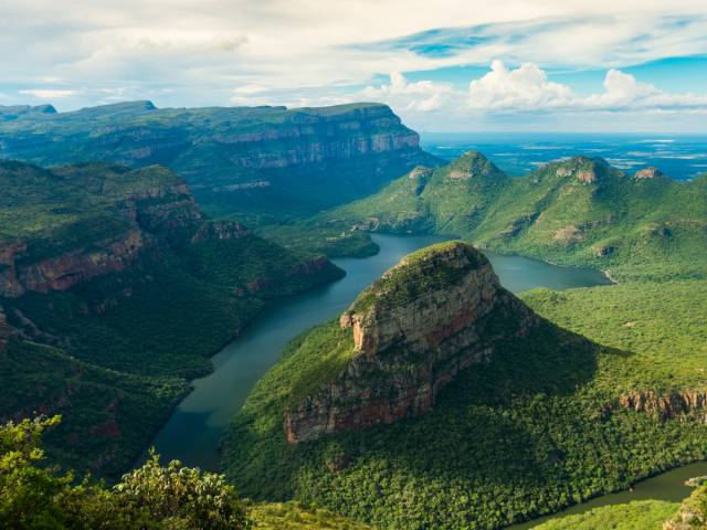 The Blyde River Canyon, South Africa

View South Africa from over 2,600 feet in the air from a hike in the Blyde River Canyon. The area is known for its colorful rock formations and lush greenery