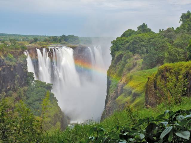Victoria Falls, Zambia and Zimbabwe

Victoria Falls sits on the border between Zambia and Zimbabwe, where a giant curtain of water  often creates rainbows amid the mist and surrounding rainforest.
