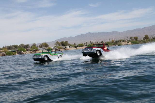 Funny picture of boats that look like cars racing in the water