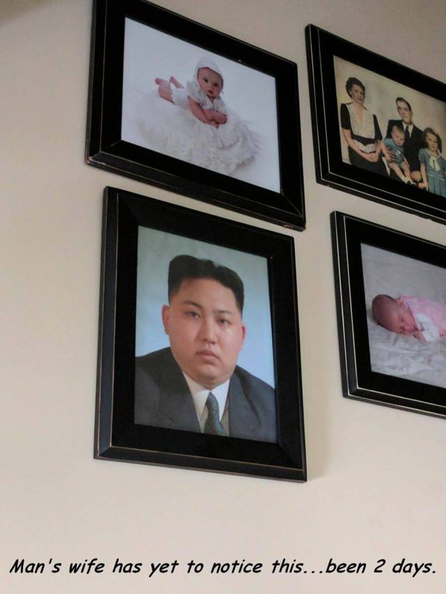 Funny picture of Kim Jong Un that man put up in living room next to family photos and wife has still not noticed