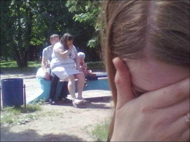 Facepalm pic of very heavy set woman sitting on normal sized man.