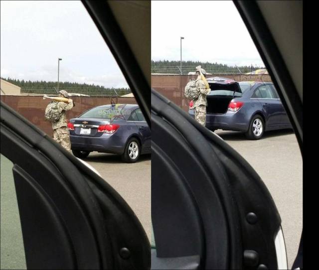 Pics of a soldier taking some kind of missile out of the back of his car.