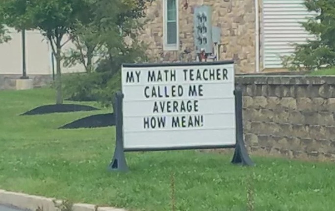 Sign about math teacher that called him average, and that is mean.