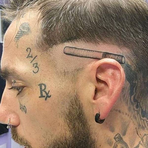 Man with tattoo of a cigarette behind his ear.