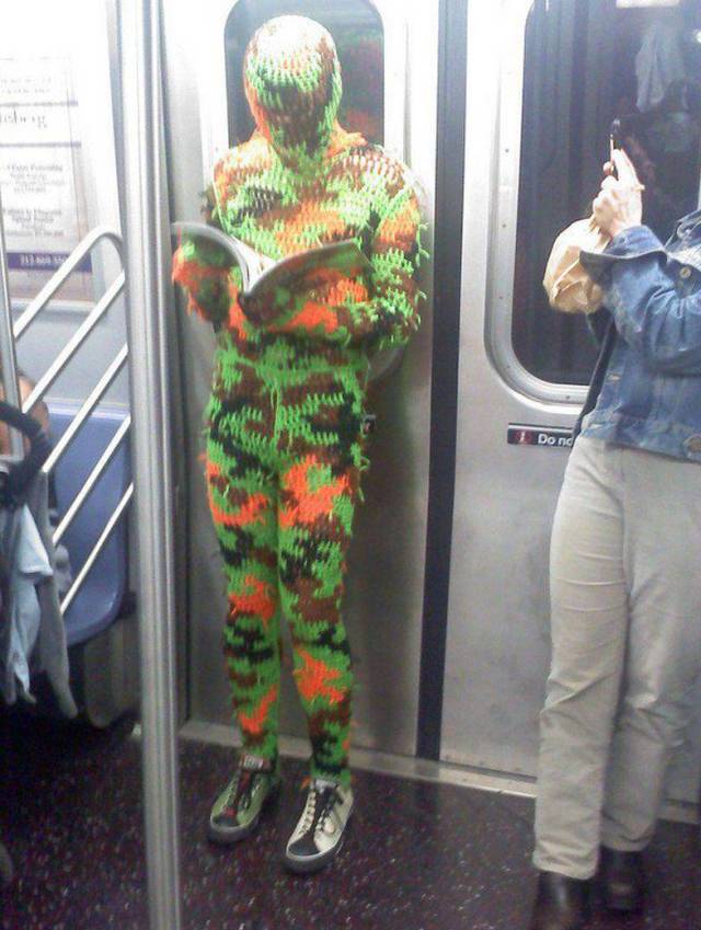 Person on teh subway in a knitted jumpsuit.