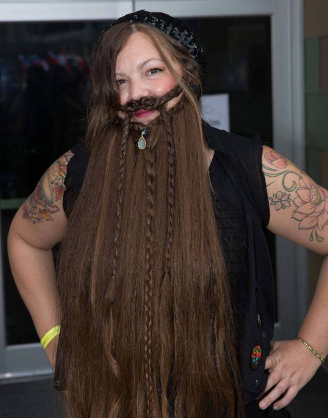 Woman with her hair made to look like a beard and mustache.