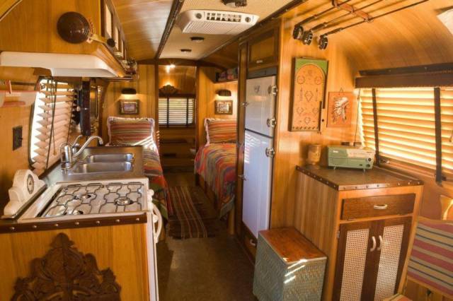 the inside of a converted bus into a camper