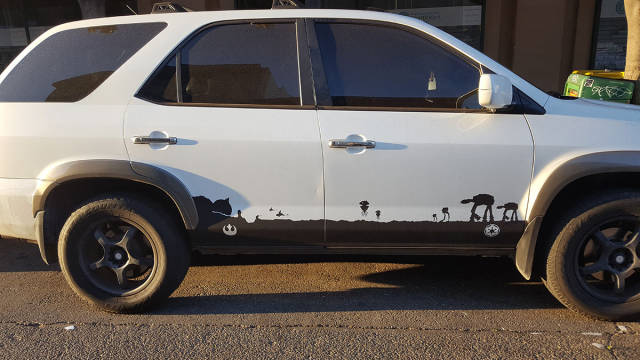Star wars scene painted onto the side of a car