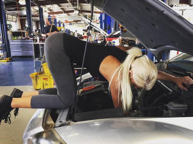 hot girl fixing a car