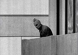This photo captures a terrorist during the Munich Massacre in 1972