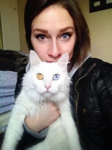 girl and cat with different colored eyes