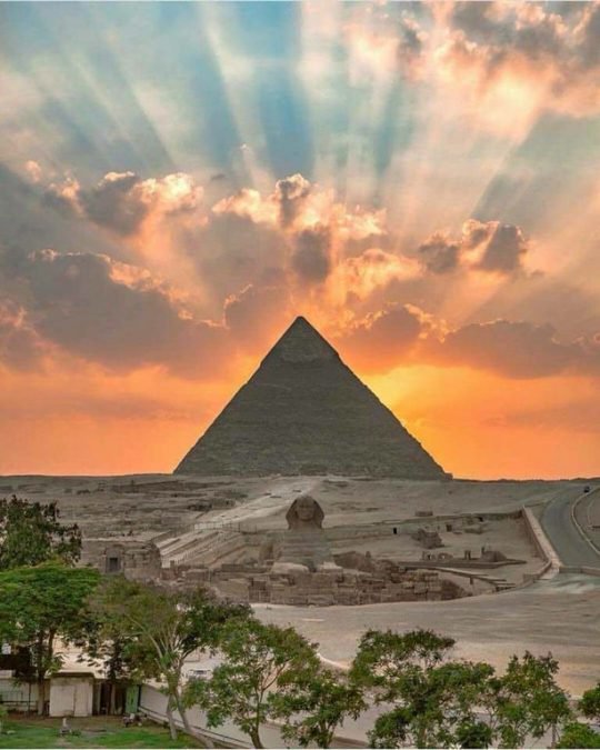 The sun rising over the pyramids in Cairo, Egypt is absolutely unbelievable.