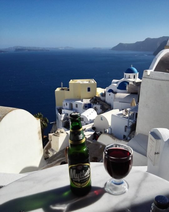 Who wouldn't want to have a drink in Santorini, Greece?