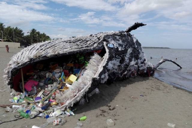 Whales choke on plastic debris.The problem of plastic pollution in the seas and oceans is becoming more serious every year. There have been cases of whales choking on plastic debris and washing ashore. To raise awareness of this, people of The Greenpeace Philippines installed a replica of a dead whale on one of the beaches in South Manila. The entire installation was made from the plastic wreck found in the ocean’s waters.