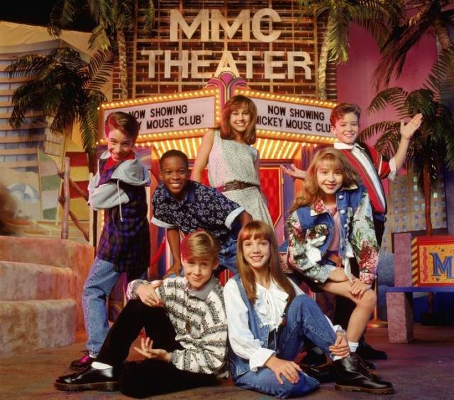 The boy on the right is Justin Timberlake, Christina Aguilera is in front of him, below are Ryan Gosling and Britney Spears. The Mickey Mouse Club, 1990s