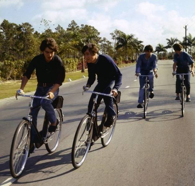 The Beatles riding bicycles, 1965