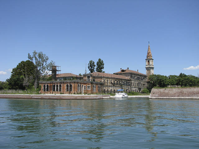 Poveglia Island, Italy-Poveglia is an island known as one of the most mysterious and creepy places in the world. It all started during the Roman Empire when the island was used to home victims of the plague. Later, during the medieval era, when the plague returned, the island once again became a home to thousands of deadly sick people. A terrible amount of people were dumped into the ground, buried in the same graves and even burned. People say that the land became so affected by the burned and rotten human corpses, its soil is now 50% composed of human ash. Then, back in 1922, they opened a mental hospital here. It is safe to say that it did not affect the patients in a positive way, since the island already had a truly creepy vibe to it. Now, you can still find washed up human bones on the island’s shore due to the horrific amount of humans killed there. With many people saying this place is haunted, no wonder this island is illegal to visit, and we’re not sure anyone would want to go there.