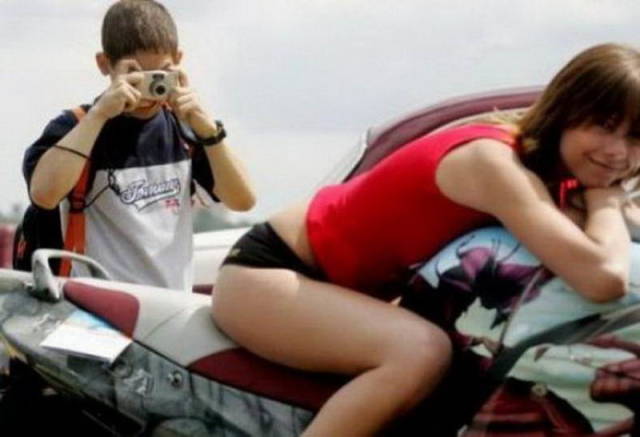kid taking a pic of a girl