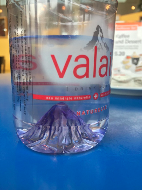 Instead of just a plain divet in the bottom of the water bottle, it’s a little mountain. Whoever designed this should be given a medal.