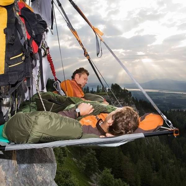 people in hammock rock climbing