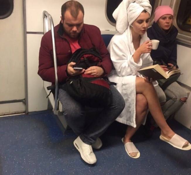 woman on a train wearing a bathrobe