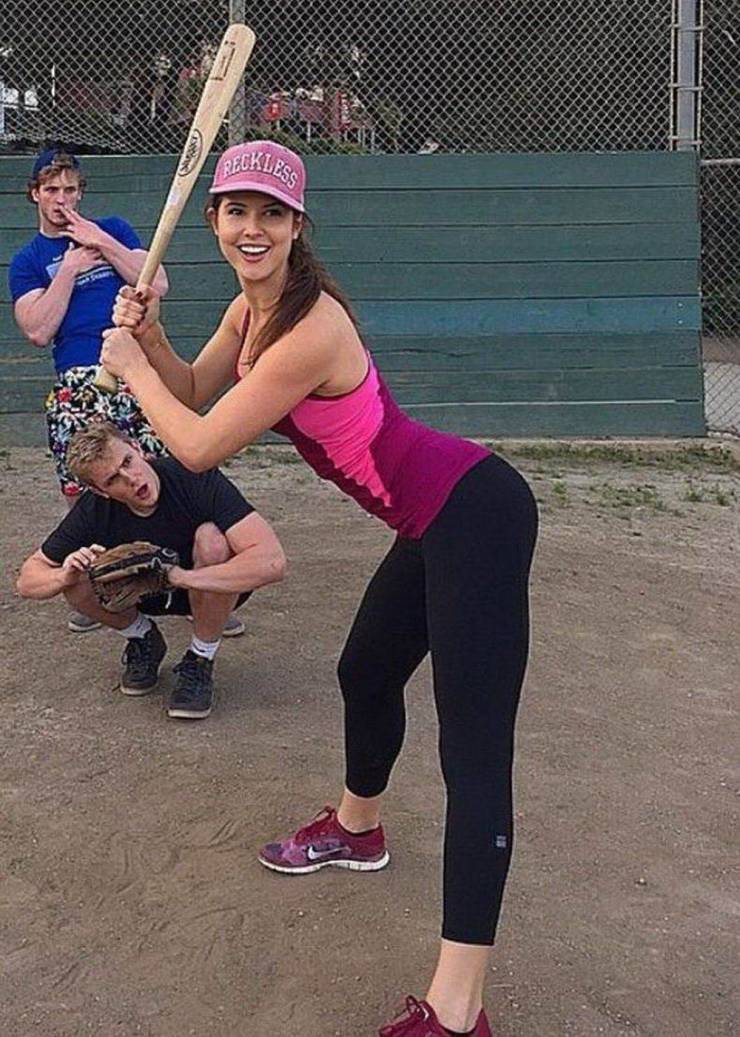 woman sticking out her butt while up to bat - jake and logan paul