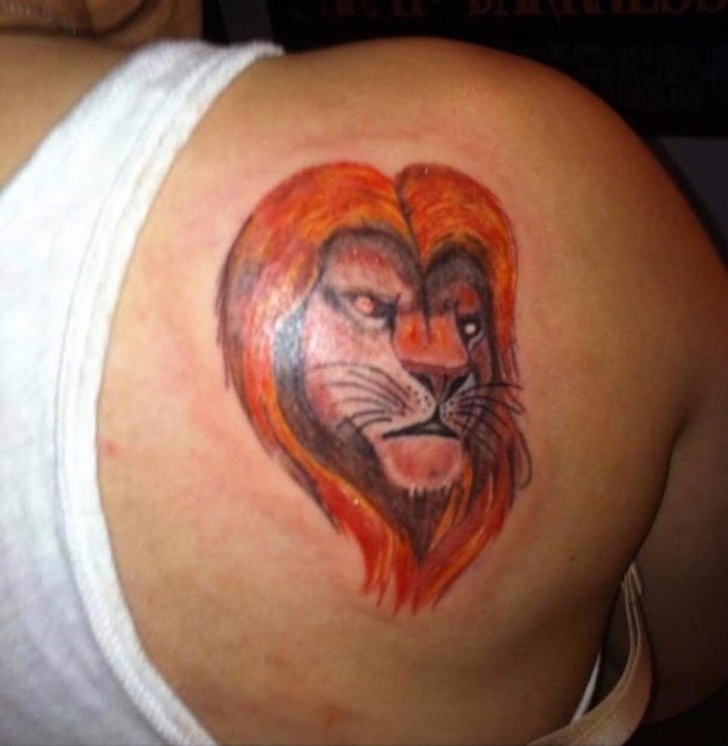 weird lion king tattoo