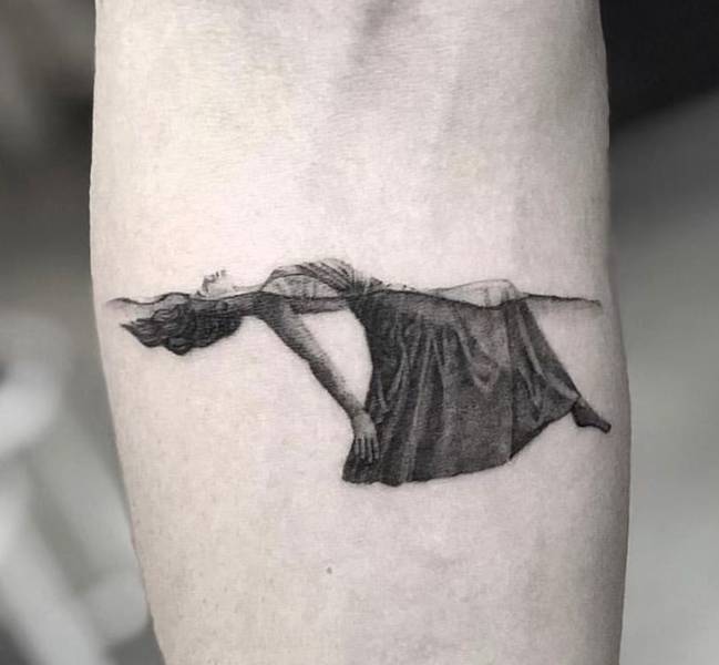 floating in water tattoo