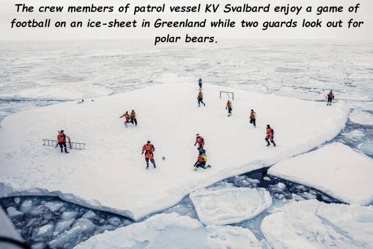 greenland occupation - The crew members of patrol vessel Kv Svalbard enjoy a game of football on an icesheet in Greenland while two guards look out for polar bears.