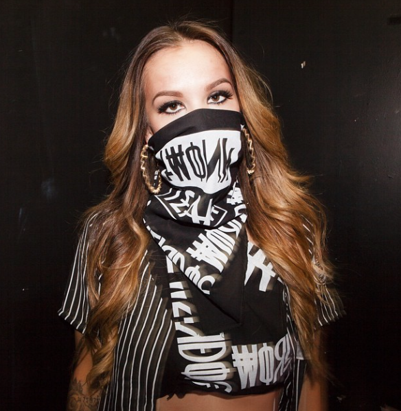 girl wearing bandana on face -