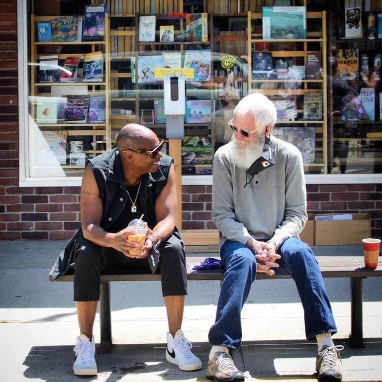dave chappelle and david letterman sitting on a bench talking