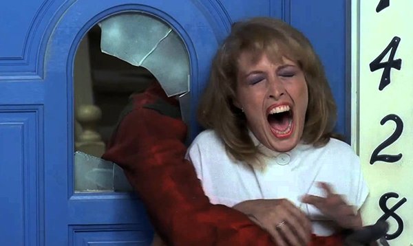 Nancy’s house has a blue door in this movie. In all of the sequels, it has the iconic red door