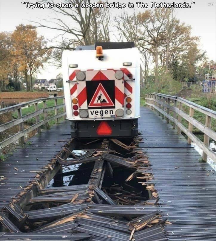 funny random pics - track - Trying to clean a wooden bridge in The Netherlands. vegen