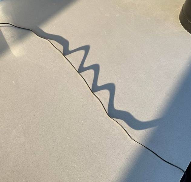 This shadow from my charging cord is wavy due to the low angle of the morning sun